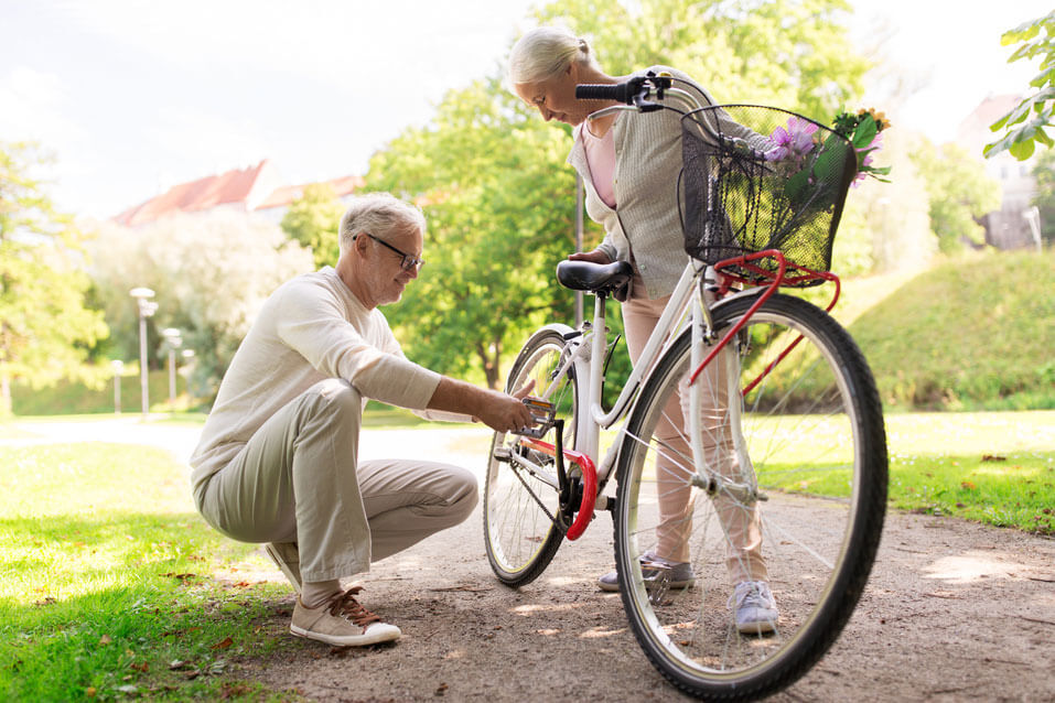 Senior Couple Helping each other fixing the cycle | Happiness 2.0